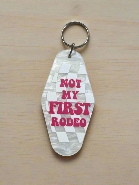 "NOT MY FIRST RODEO" Keychain - Pink Retro Checkerboard Motel Key Tag