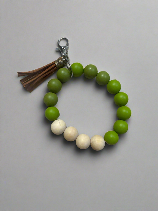 green silicone bead wristlet keychain bracelet with wood beads and brown tassel
